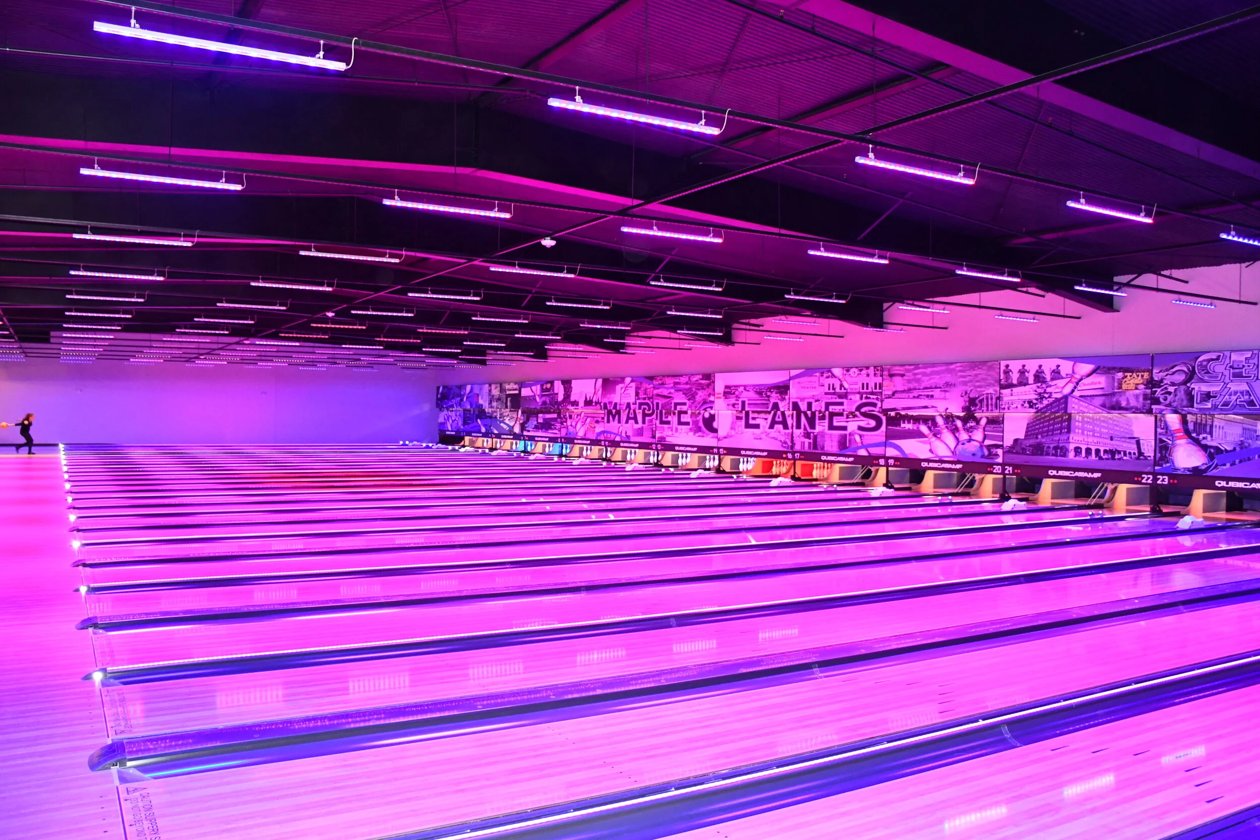 bowling lanes light up under black lighting